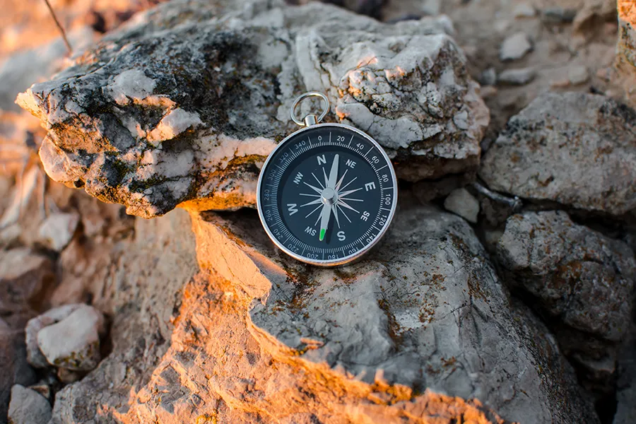 Compass on rocks