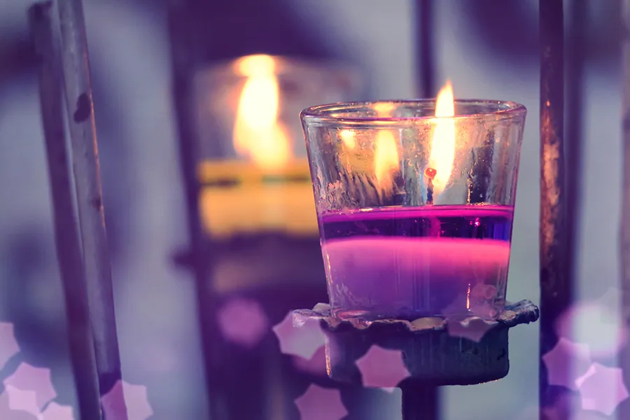 One lit purple candle
