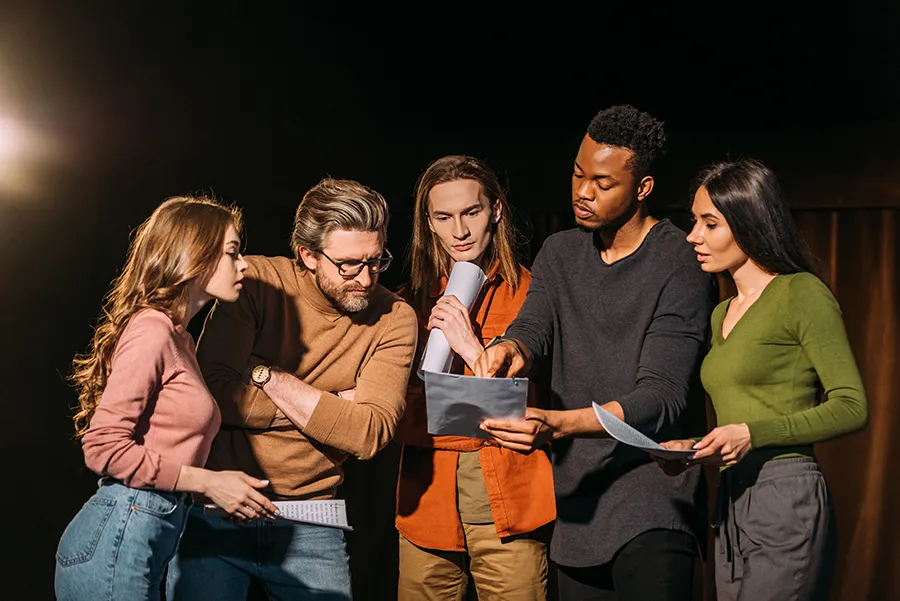 Young adults consult a script together